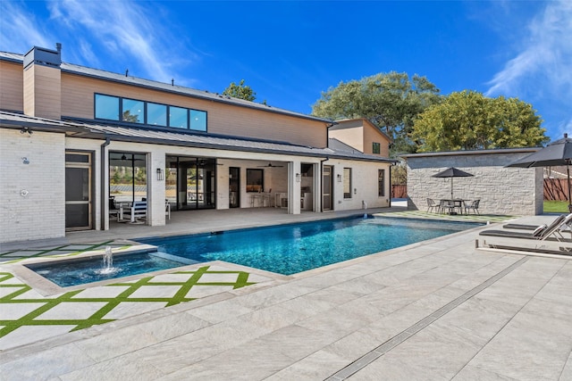 outdoor pool featuring a patio