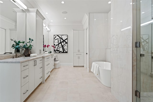 bathroom featuring a shower stall, ornamental molding, a freestanding bath, and vanity