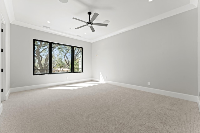 unfurnished room featuring recessed lighting, light carpet, visible vents, baseboards, and ornamental molding