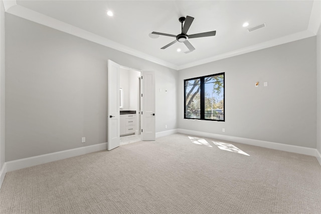 unfurnished bedroom featuring recessed lighting, visible vents, ornamental molding, light carpet, and baseboards