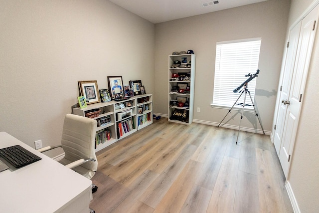 home office featuring light hardwood / wood-style floors