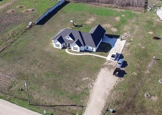 birds eye view of property with a rural view