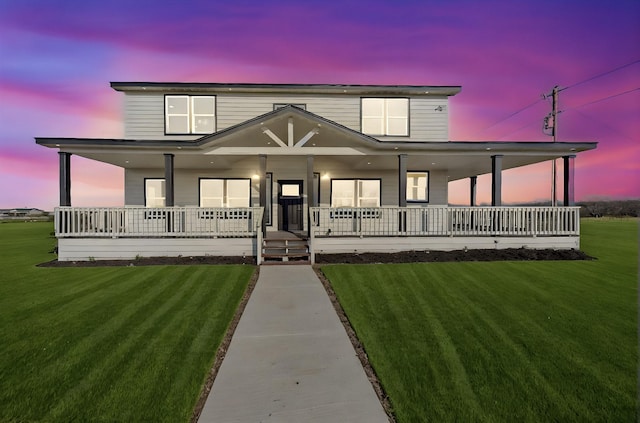 view of front of property featuring a porch and a yard