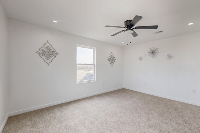 unfurnished room featuring carpet floors, baseboards, recessed lighting, and visible vents