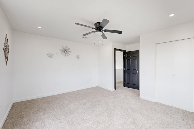 unfurnished bedroom with recessed lighting, baseboards, and light colored carpet