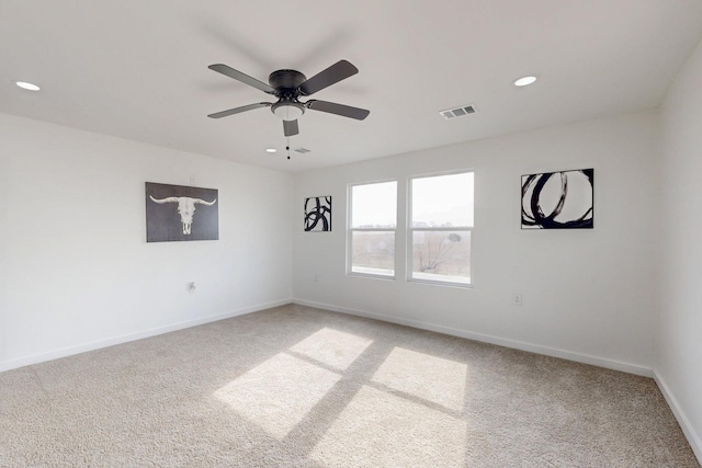 unfurnished room featuring ceiling fan, light carpet, recessed lighting, baseboards, and visible vents