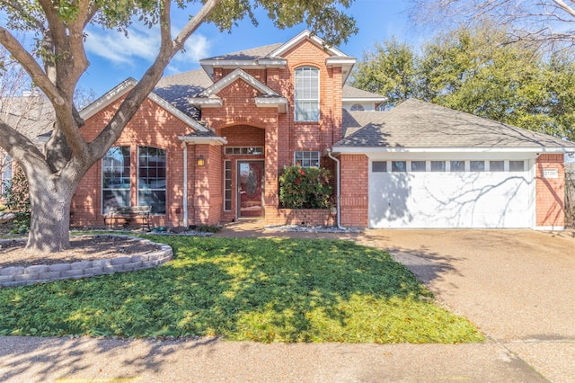 front of property featuring a front yard and a garage