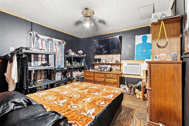 bedroom featuring a textured ceiling and hardwood / wood-style floors