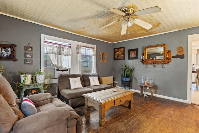 living room with hardwood / wood-style floors, ceiling fan, crown molding, and cooling unit