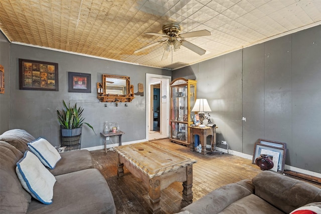 living room with hardwood / wood-style floors and ceiling fan