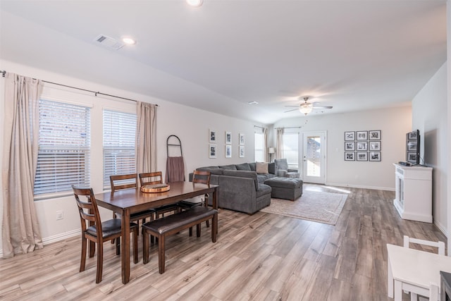 dining space with light wood finished floors, recessed lighting, visible vents, a ceiling fan, and baseboards