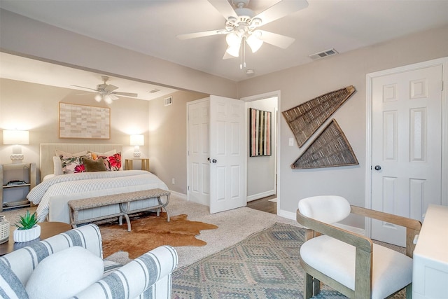 carpeted bedroom with ceiling fan