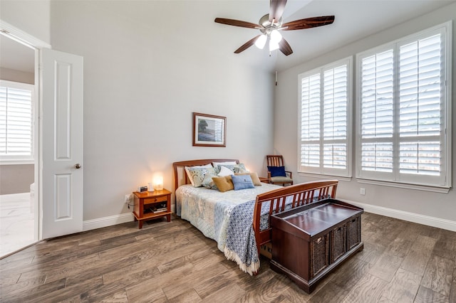 bedroom with ceiling fan and wood-type flooring