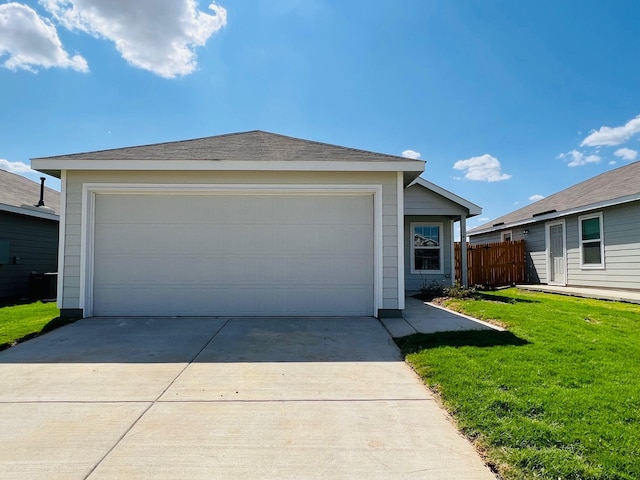 ranch-style home with a front yard and a garage