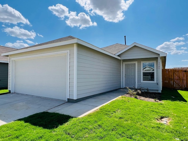 ranch-style house with a garage and a front yard