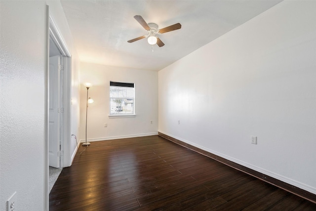 unfurnished bedroom with ceiling fan and dark hardwood / wood-style flooring