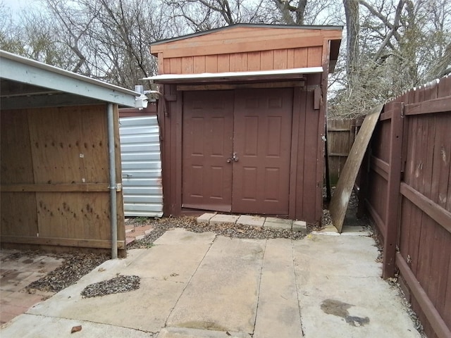 view of shed with a fenced backyard