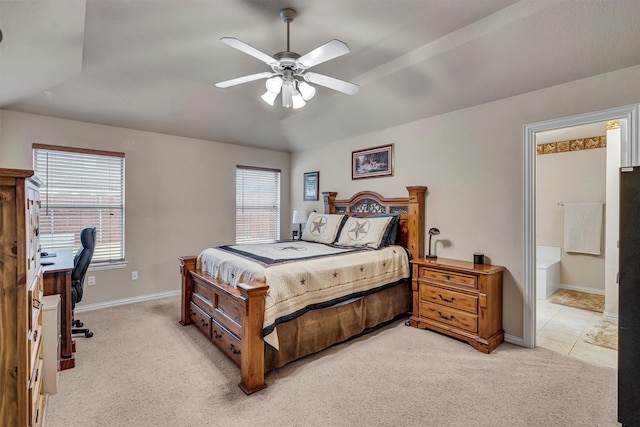 carpeted bedroom featuring ensuite bathroom and ceiling fan