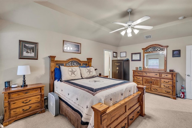 bedroom with ceiling fan, vaulted ceiling, and light carpet