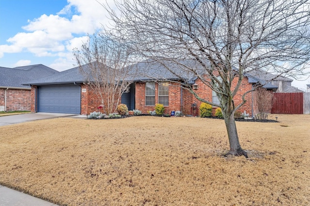 single story home featuring a front yard and a garage