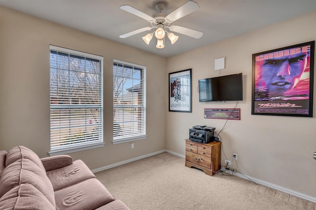 living room featuring light carpet and ceiling fan