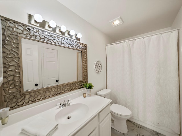 bathroom with toilet and vanity