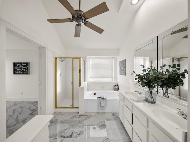 bathroom featuring vaulted ceiling, independent shower and bath, and vanity