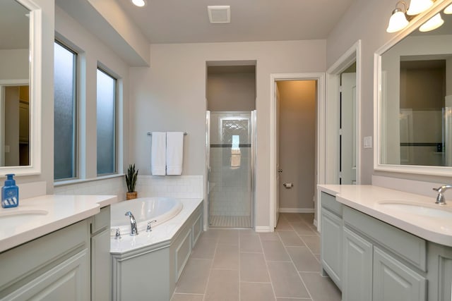 bathroom with separate shower and tub, tile patterned flooring, and vanity