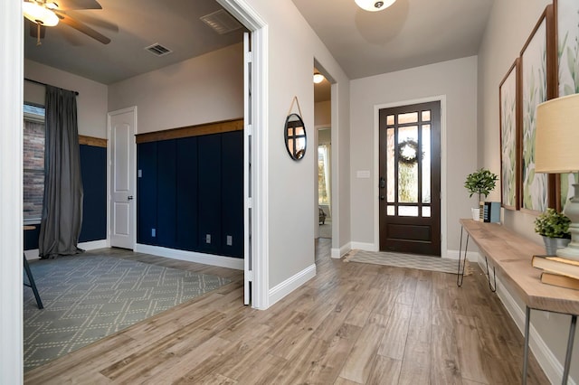 entryway with hardwood / wood-style floors and ceiling fan