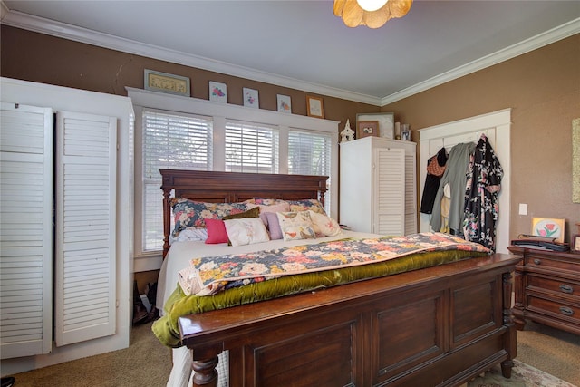 bedroom with crown molding and carpet floors