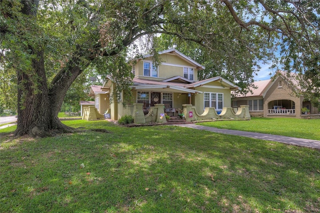 view of front of property with a porch and a front yard