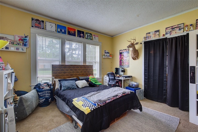 bedroom with light colored carpet, a textured ceiling, and ornamental molding