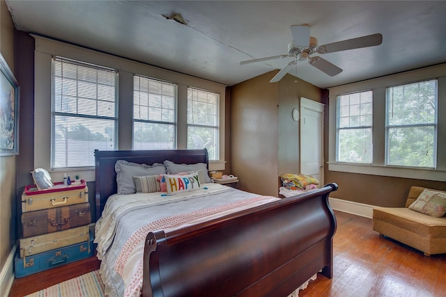 bedroom with ceiling fan and light hardwood / wood-style floors