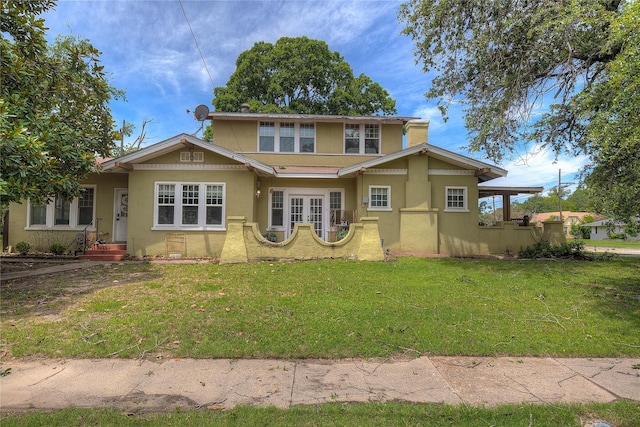 view of front of home with french doors and a front yard