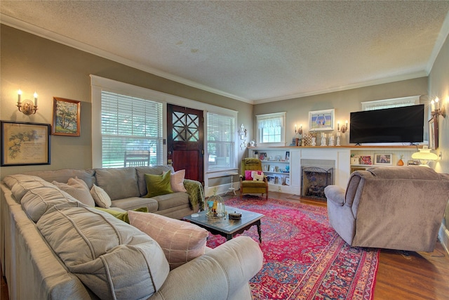 living room featuring ornamental molding, a textured ceiling, and hardwood / wood-style floors