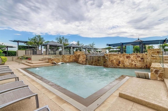 view of swimming pool featuring pool water feature and a gazebo