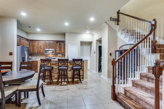 5320 Locust Dr, Mckinney, TX 75070 - dining room featuring light tile patterned floors, stairway, recessed lighting, and baseboards