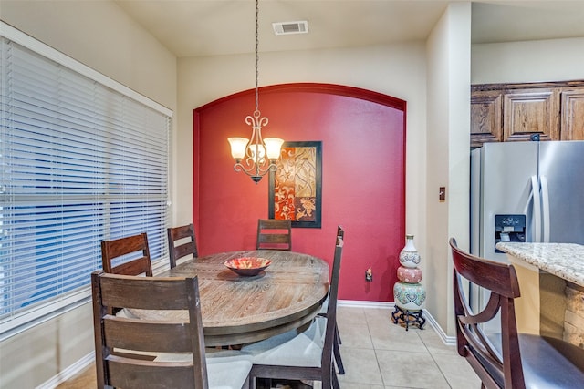 5320 Locust Dr, Mckinney, TX 75070 - dining space featuring a chandelier, light tile patterned floors, and baseboards
