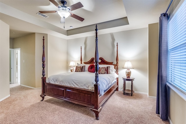 5320 Locust Dr, Mckinney, TX 75070 - bedroom with light carpet, a tray ceiling, baseboards, and ceiling fan