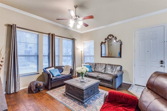 living room featuring ornamental molding, dark wood-type flooring, and ceiling fan