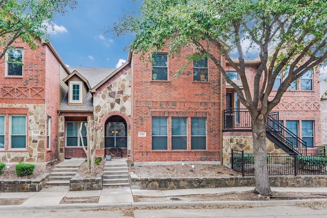 5320 Locust Dr, Mckinney, TX 75070 - view of front of house featuring stairs, stone siding, brick siding, and fence