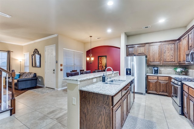 5320 Locust Dr, Mckinney, TX 75070 - kitchen featuring appliances with stainless steel finishes, a sink, light tile patterned floors, arched walkways, and light stone countertops