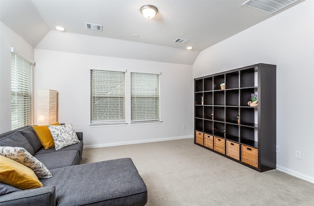 living area with light carpet and lofted ceiling