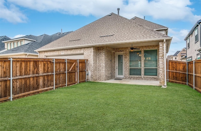 back of property featuring a patio, a lawn, and ceiling fan