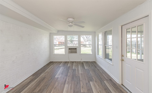 unfurnished sunroom featuring a healthy amount of sunlight and ceiling fan