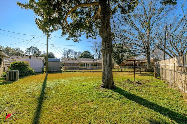 view of yard featuring central air condition unit