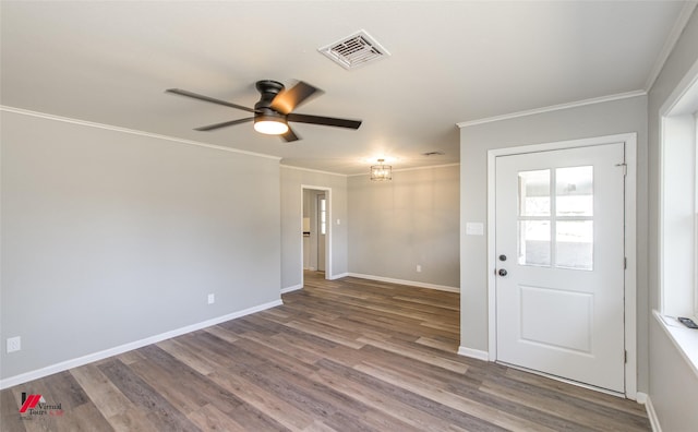 unfurnished room featuring ceiling fan, ornamental molding, and wood-type flooring