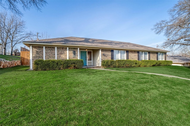 single story home featuring brick siding and a front yard