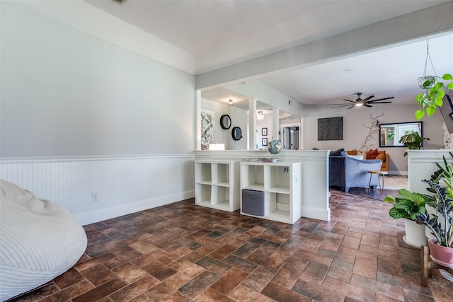 2248 Dorrington Dr, Dallas, TX 75228 - kitchen with a wainscoted wall, ceiling fan, dark stone finish flooring, baseboards, and open floor plan