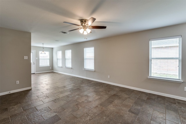 unfurnished room with ceiling fan